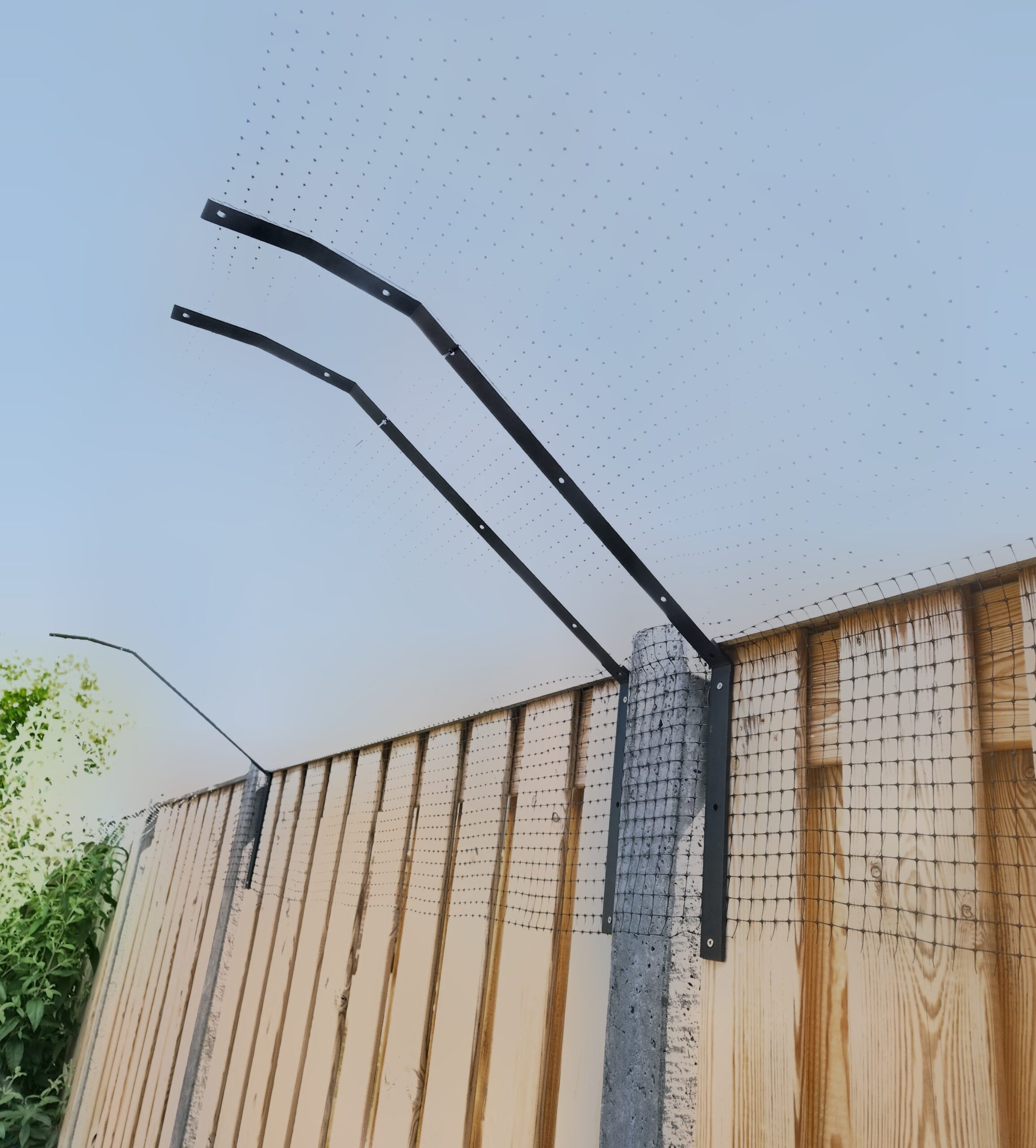 kattenbeugel aan de schutting
